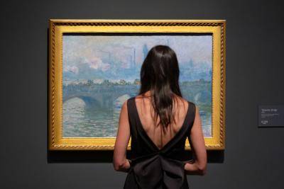 Woman looking at Monet painting