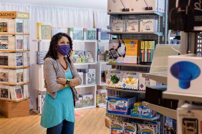 A woman browsing at the museum's Pop-Up Shop.