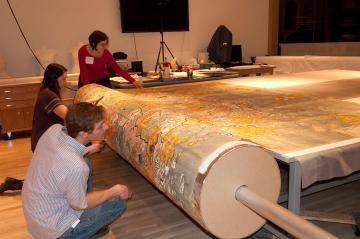 The conservation staff working on a large map