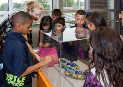 Children looking at an Art Lives Here exhibition
