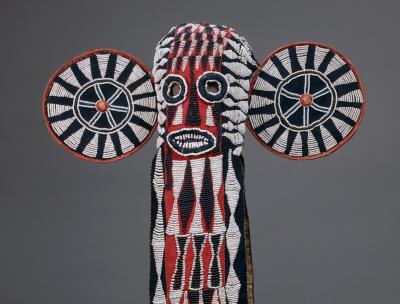 Mask made with black and white glass beads and red and black cloth