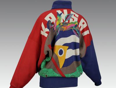 a jacket photographed from the back with the word Kansai and birds and colorful shapes