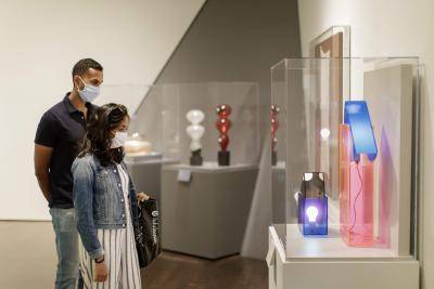 Visitors looking at art at the Denver Art Museum