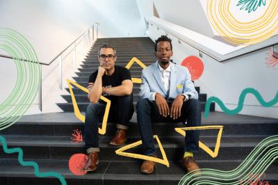 Ramon Bonilla and Brenton Wei sitting on the steps of the museum