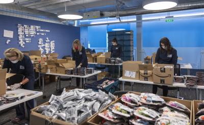 Volunteers assembling art kits at the Denver Art Museum