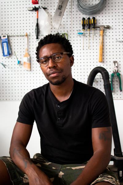 Portrait of the artist Simphiwe Ndzube at his studio