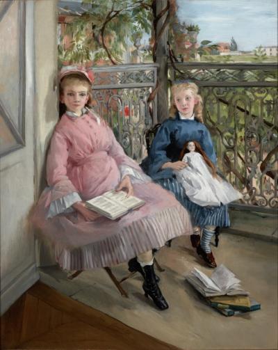 Two young girls sitting by the window
