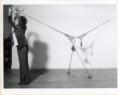 Still photograph of a Senga Nengudi performance in progress.