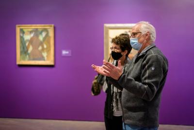 Older couple chatting about art in the galleries