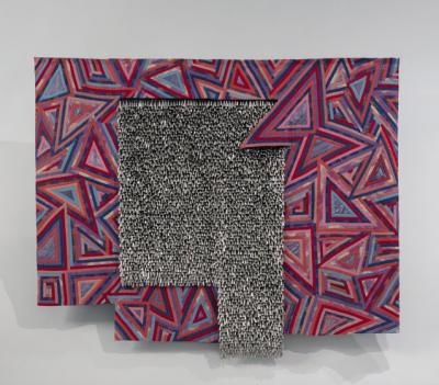 Large textile comprised of dozens of overlapping triangle patterns in red, pink, blue and purple. In the center, a blanket of silver tin jingles lays on top of the textile.