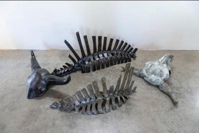 Sculpture mimicking the spines and skulls of two bison.
