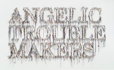shoe laces hanging in strands spelling the words Angelic Trouble Makers
