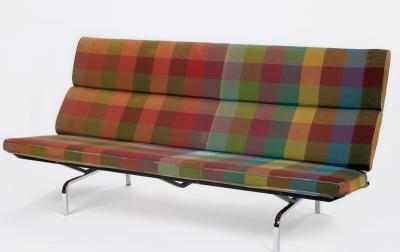 red, blue, green, and yellow plaid Eames sofa with metal legs