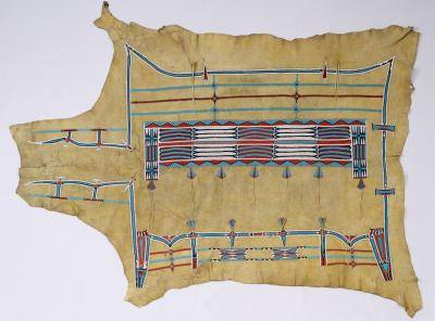 Native American robe made out of bison head and decorated with beaded patterns