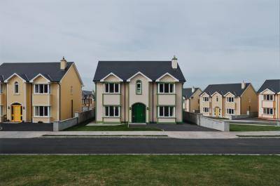 Photograph of suburban two-story houses that all look alike