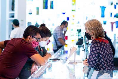 Couple in the Shop talking with associate at the counter