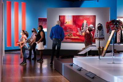 Group of visitors exploring the Indigenous arts gallery