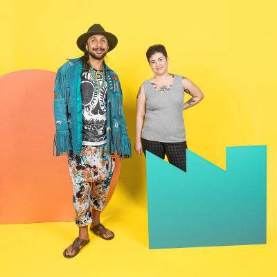 Artists Cal Duran and Sarah Fukami posing together