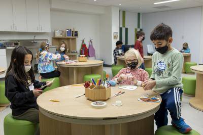 Children doing arts and crafts in the Creative Hub at the Denver Art Museum.