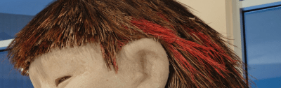 Close-up of the grass hair atop the Mud Woman sculpture