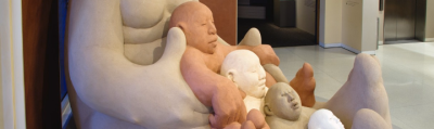 Close up view of the different colors of mud in the Mud Woman sculpture