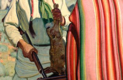 Native American man holding a rabbit