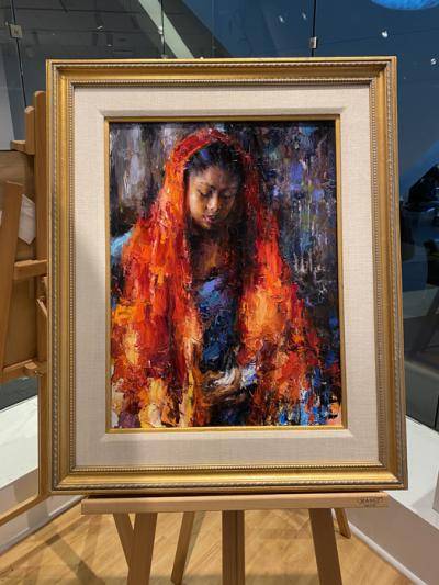 Painting of a woman with a red scarf