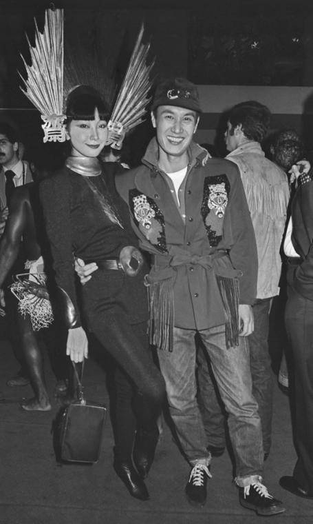 Japanese fashion designer Kansai Yamamoto posed with a young woman