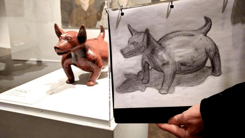 photo of a drawing of a dog statute by a student at a drop-in drawing class in Stampede