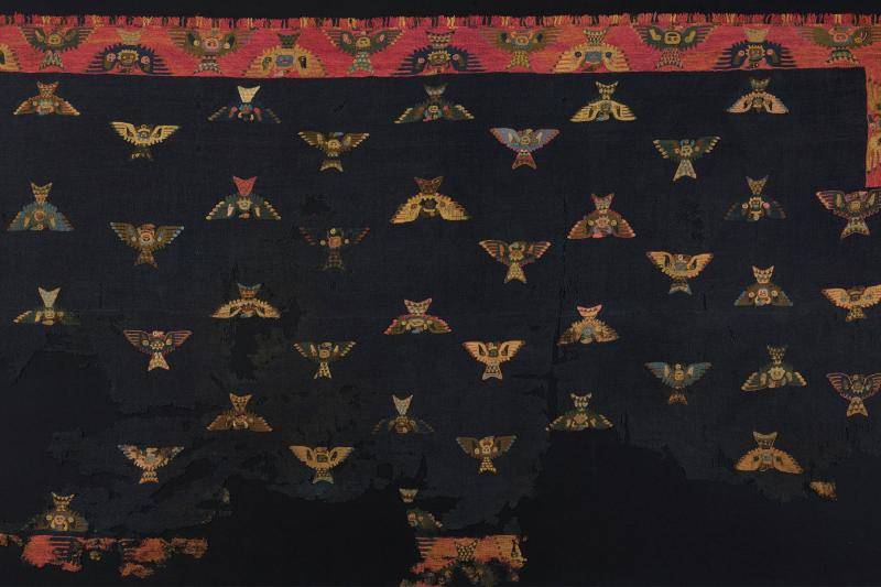 Black mixed media textile with moth pattern