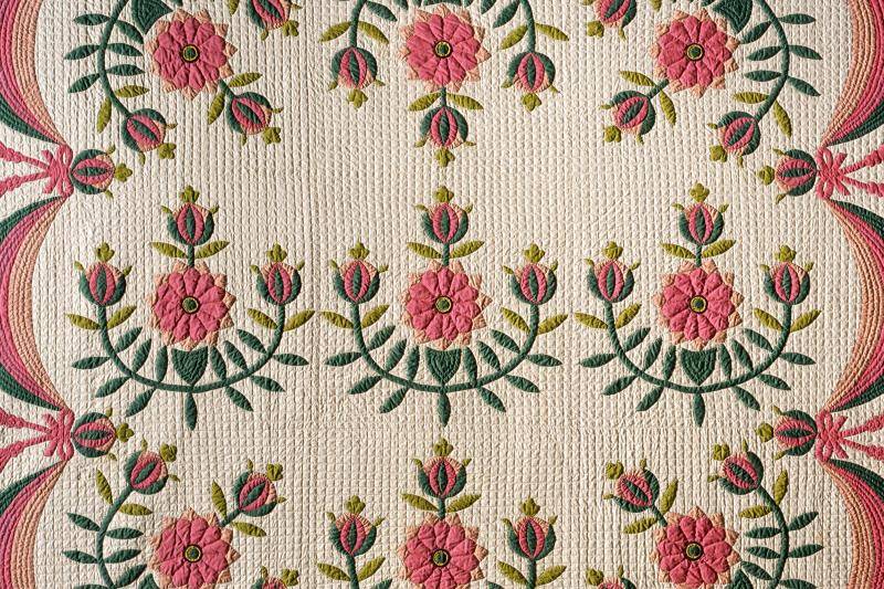 Red and green floral patterned quilt