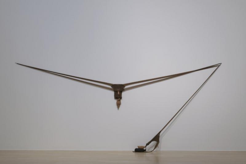 Two pairs of nylon pantyhose stretched in a 12 foot wide V-shape. A third pair of pantyhose, weighted with sand, stretches diagonally from the right corner of the V-shape to the ground.