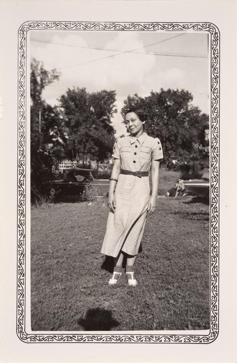 A woman in a dress on a lawn