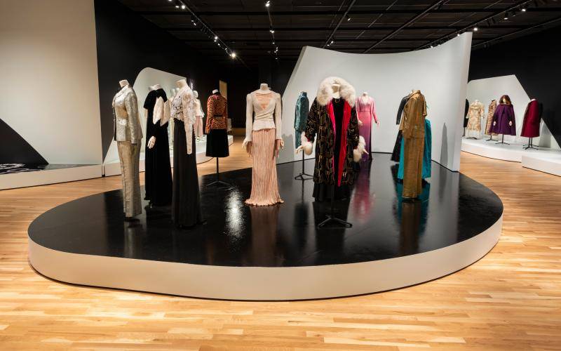 Interior shot of the Suited gallery with mannequins displaying various garments