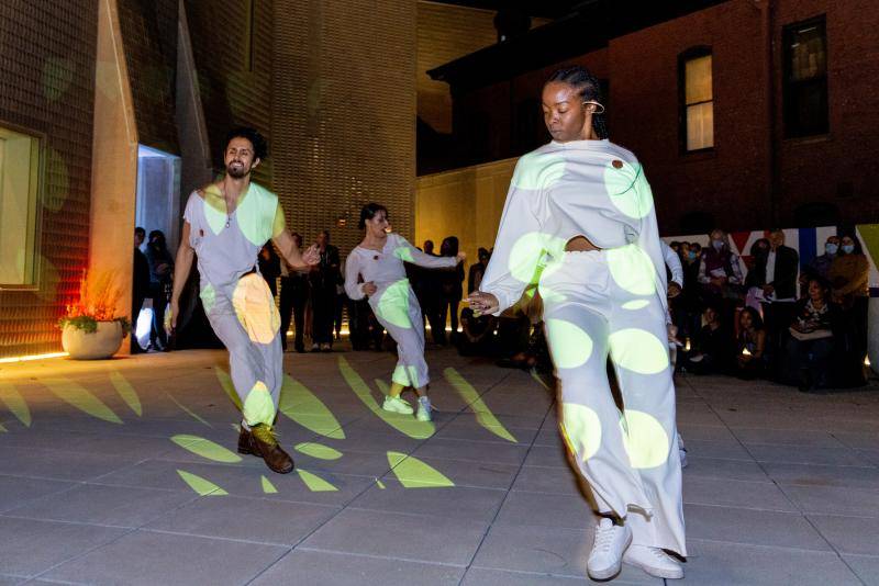 Dancers performing on the rooftop terrace of the Martin Building