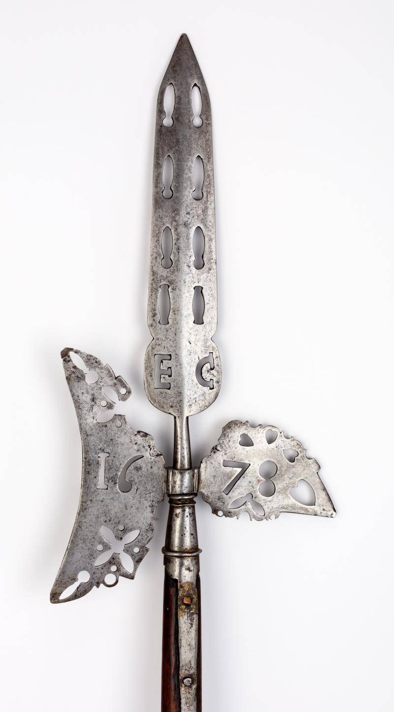 Close-up view of a steel and wood pike head of a halberd from 1678