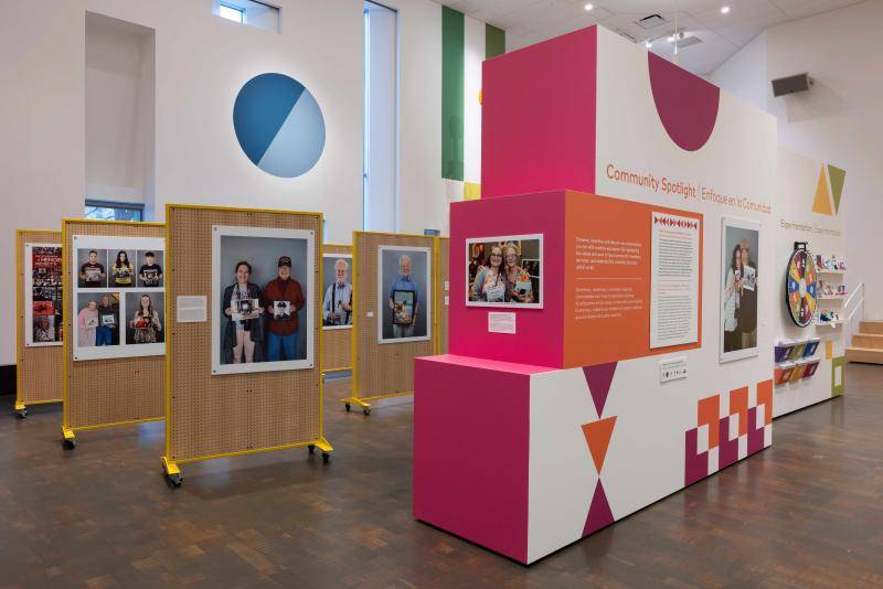 Angled view of easels displaying photographs inside the exhibition