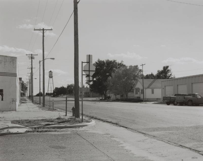 Black and white photograph of a deserted intersection in Kansas