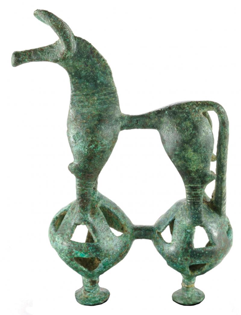 Bronze sculpture of horse figure standing on two circular spheres