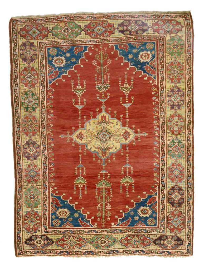 Rectangular red and brown rug depicting patterns representing jewelry pendants