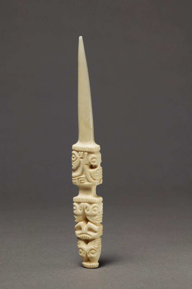Small pointed object resembling a knife made out of whale ivory