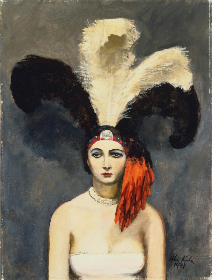 Woman from the 1930s flapper era wearing an elaborate black and white feathered headpiece