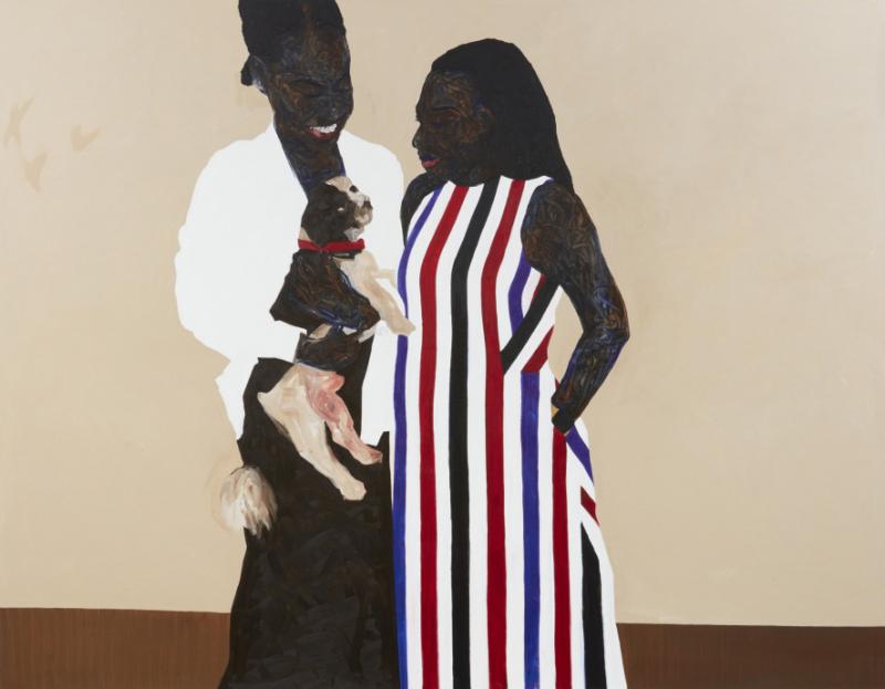 Two Black woman looking at a brown dog one of them is holding