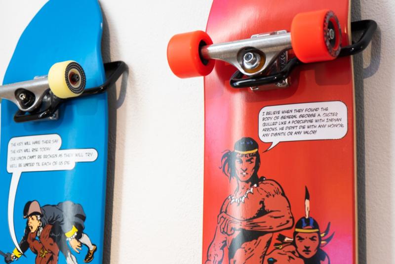 Blue and red skateboards with graphic novel-like drawings