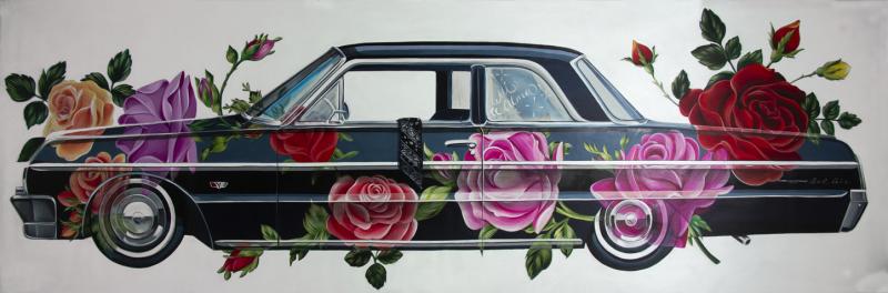 Low rider car decorated in bright red and pink floral arrangements
