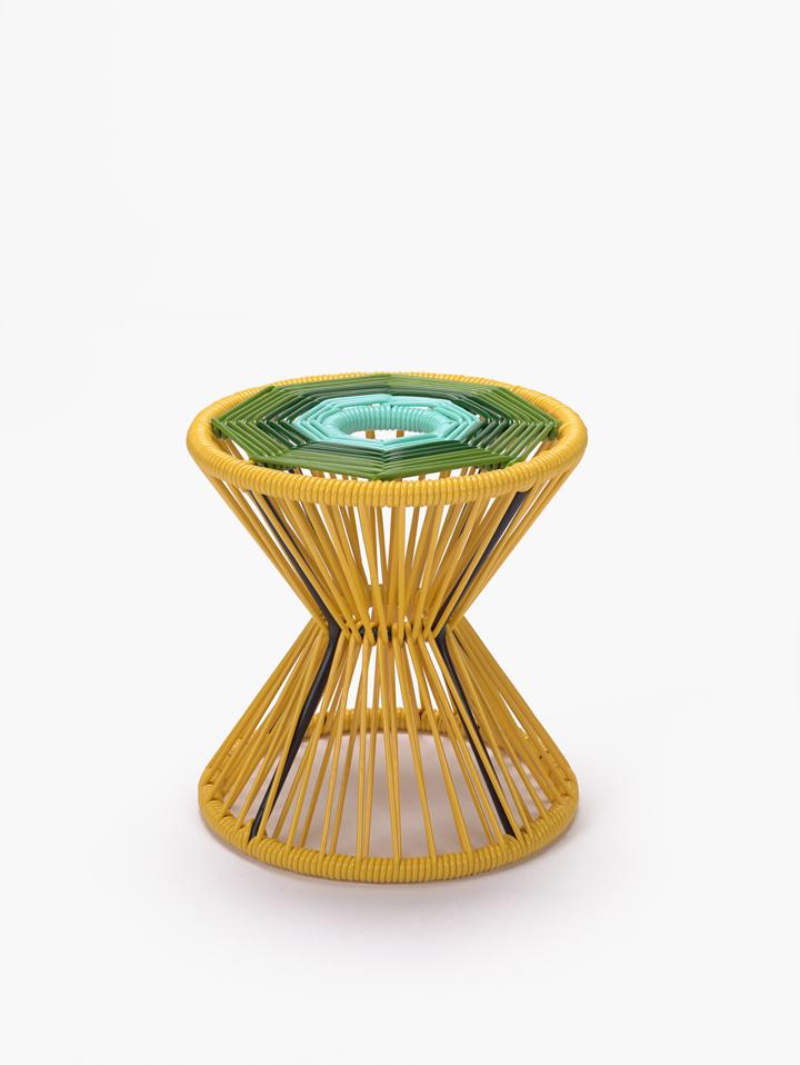Iron stool painted bright yellow adorned with polyvinyl fabric