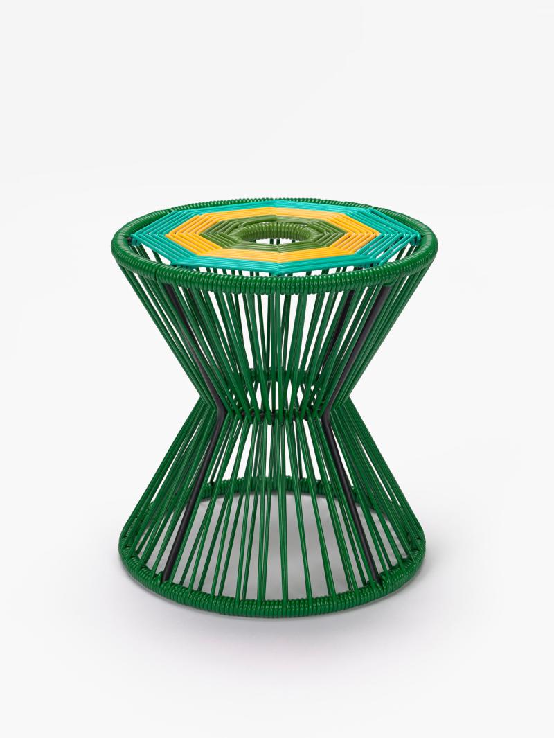 Iron stool painted bright green adorned with polyvinyl fabric
