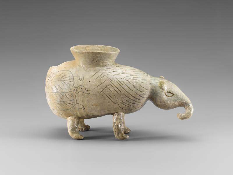 White elephant-shaped vessel with cone-like shape on its back