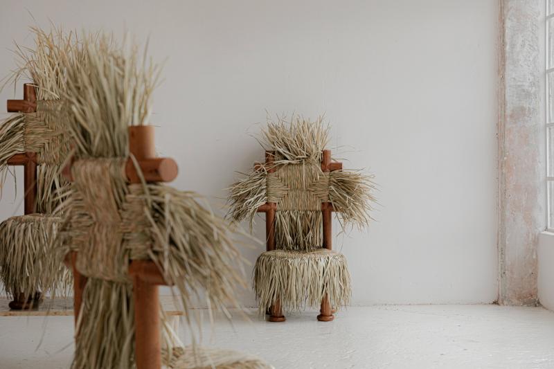 Wooden chair with bleached palm tree seat