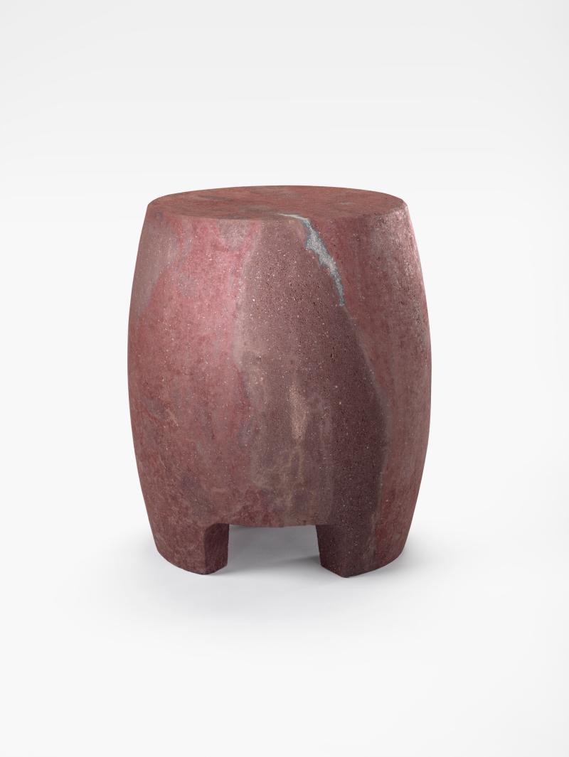 Small oval-shaped stool made out of lava stone